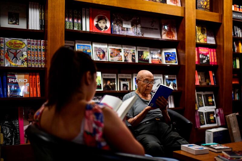 People read books in the "El Ateneo Grand Splendid" bookstore . AFP