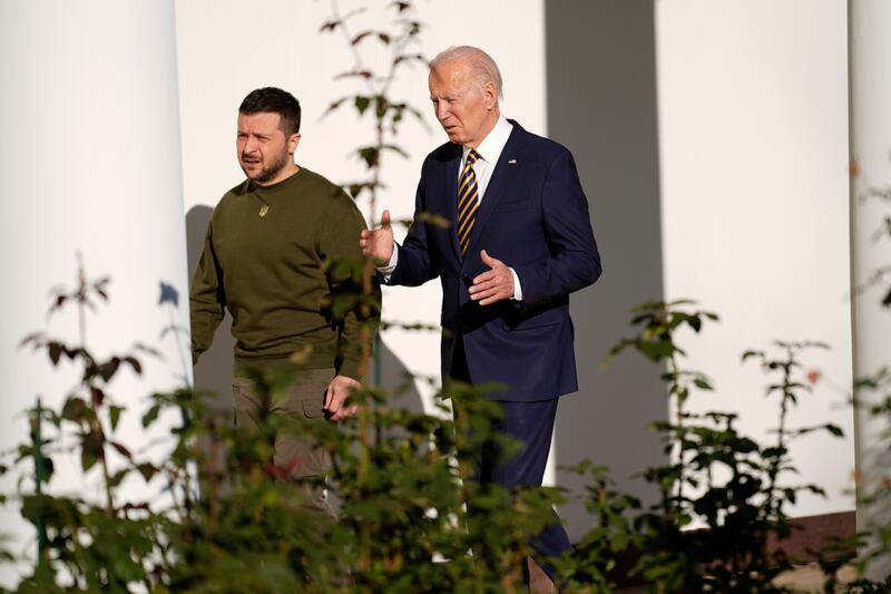 Mr Biden wore a blue and yellow tie, the colours of the Ukrainian flag, for Mr Zelenskyy's visit. AP