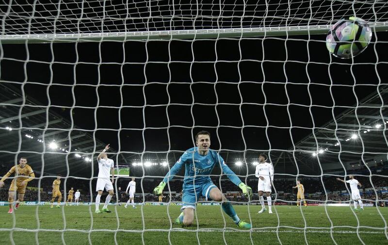 Swansea City's Lukasz Fabianski looks dejected after Tottenham's Dele Alli scored their first goal. Tottenham won 3-1. Andrew Couldridge / Reuters