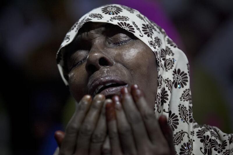 A woman cries as she prays at Baitul Mukarram, the National Mosque, on Eid Al Fitr July 18, 2015 in Dhaka, Bangladesh. Allison Joyce / Getty Images