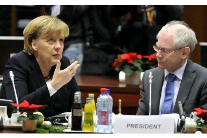 German chancellor Angela Merkel, seen talking with the European Council president, Herman Van Rompuy, at the EU summit in Brussels. European leaders signalled a willingness to grant troubled nations a fresh financial lifeline, ring-fencing the euro in a bid to fend off market vultures once and for all.