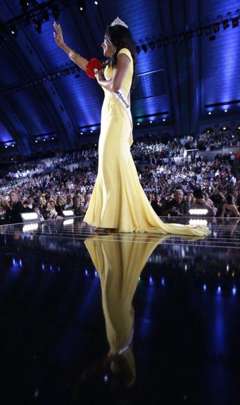Miss New York Nina Davuluri walks on the runway after being crowned as Miss America 2014, in Atlantic City, N.J. AP Photo/Julio Cortez