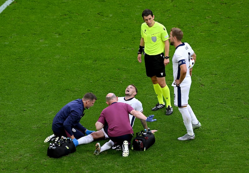 Kieran Trippier of England receives medical treatment before he was replaced by Cole Palmer. Getty Images