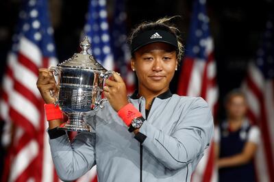 NEW YORK, NY - SEPTEMBER 08: Naomi Osaka of Japan poses with the championship trophy after winning the Women's Singles finals match against Serena Williams of the United States on Day Thirteen of the 2018 US Open at the USTA Billie Jean King National Tennis Center on September 8, 2018 in the Flushing neighborhood of the Queens borough of New York City.   Julian Finney/Getty Images/AFP
== FOR NEWSPAPERS, INTERNET, TELCOS & TELEVISION USE ONLY ==
