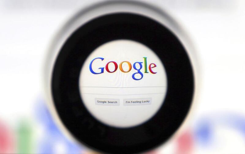 A Google search page is seen through a magnifying glass. Francois Lenoir / Reuters