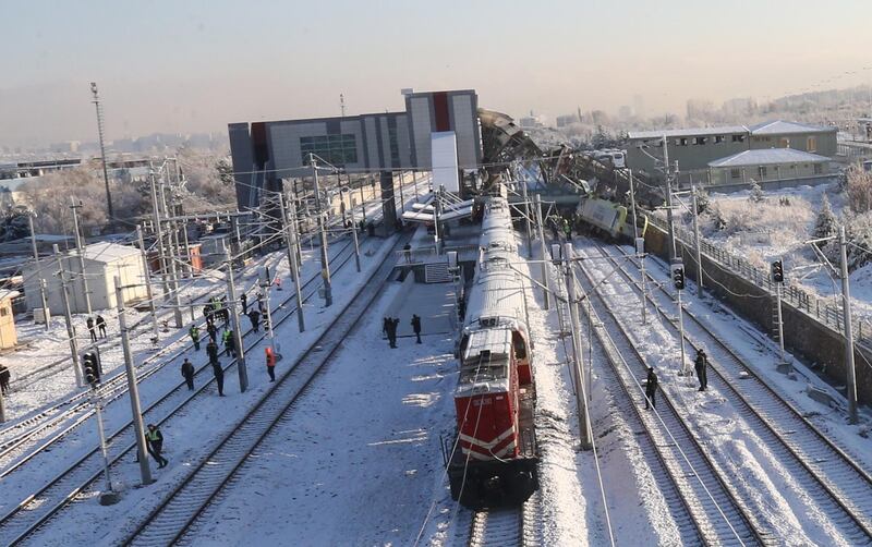 Firefighters and medics try to rescue victims after a high speed train accident in Ankara. EPA