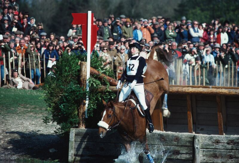 Princess Anne falls at the water jump during the cross country event at Badminton Horse Trials in 1982.