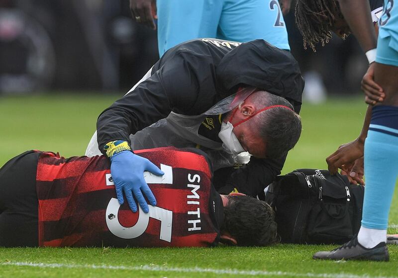 Adam Smith - 7: Typified Bournemouth's battling spirit. Carried off on a stretcher with a head injury in the second period. EPA