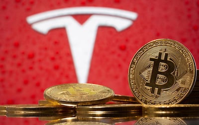 FILE PHOTO: Representations of virtual currency Bitcoin are seen in front of Tesla logo in this illustration taken, February 9, 2021. REUTERS/Dado Ruvic/File Photo/File Photo