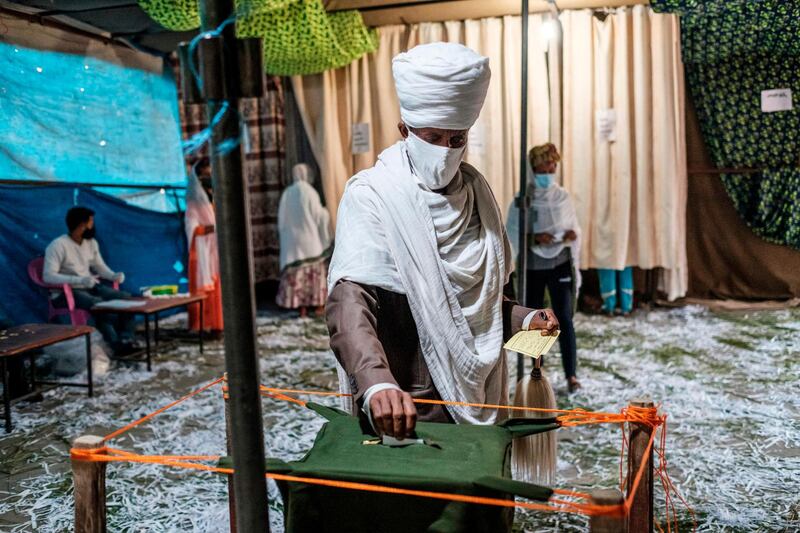 A Ethiopian Orthodox Priest casts his ballot at a polling station during Tigray’s regional elections, in the city of Mekele, Ethiopia. AFP