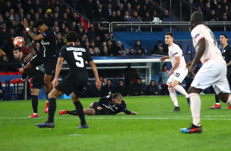PARIS, FRANCE - MARCH 06:  Prenel Kimpembe of PSG handles the ball inside the area from Diogo Dalot of Manchester United shot leading to a penalty via VAR during the UEFA Champions League Round of 16 Second Leg match between Paris Saint-Germain and Manchester United at Parc des Princes on March 06, 2019 in Paris, France. (Photo by Julian Finney/Getty Images)