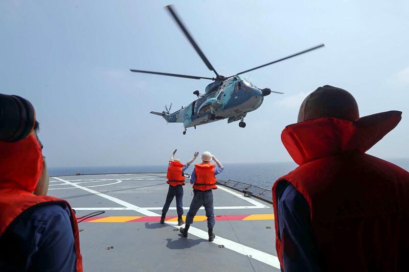 An Iranian army helicopter landing on a navy warship during the last day of a military exercise in the Gulf. AFP, HO via Iranian Army website