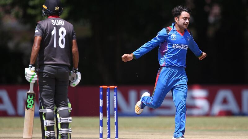 Rashid Khan celebrates the wicket of batsman Chirag Suri during Afghanistan's World Cup Qualifier victory over the UAE. Courtesy ICC