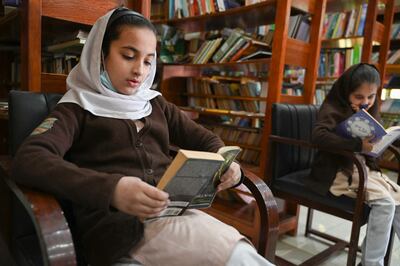 School students inside the Darra Adam Khel Library in Darra Adamkhel town, some 35 kilometres (20 miles) south of Peshawar, on December 14, 2022. AFP