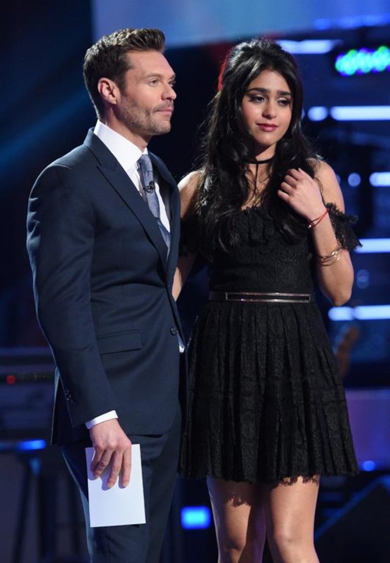 Host Ryan Seacrest announces eliminated contestant Sonika Vaid onstage. Michael Becker / FOX via Getty Images