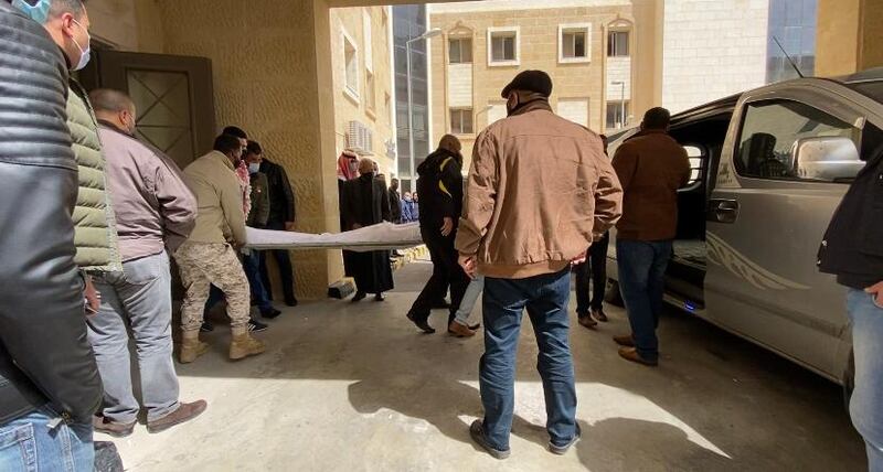 Families of the victims wait outside the morgue to collect the bodies of their loved ones. 