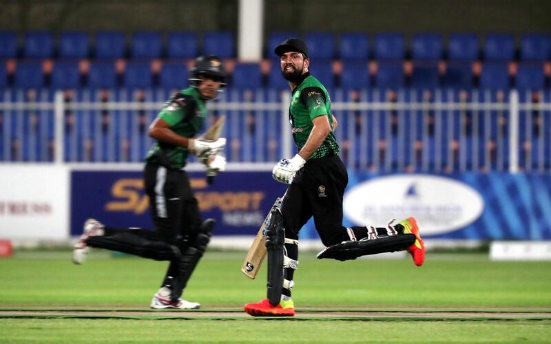 LEFT TO RIGHT- Aryan Lakra and Rohan Mustafa of Future Mattress running between the wickets in the Sharjah Ramadan Cup final between Future Mattress vs MCM Cricket Club held at Sharjah International Cricket Stadium in Sharjah on May 7,2021. Pawan Singh / The National. Story by Paul