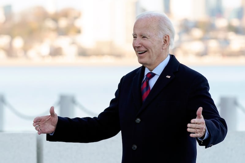 Mr Biden reacts seeing Prince William outside the library. AP