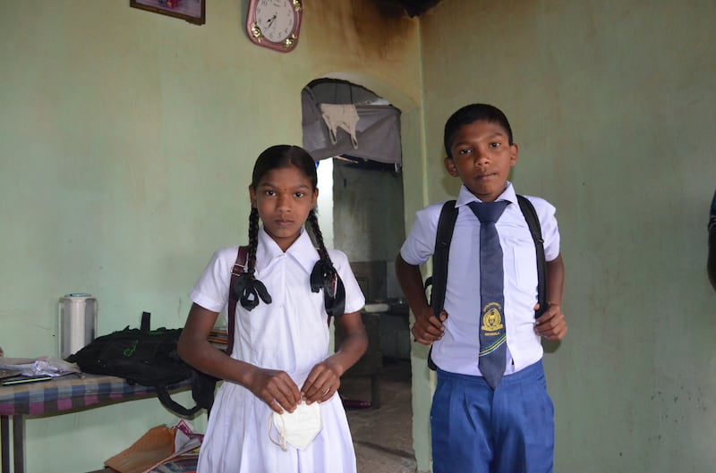 Schoolchildren Nishanthini and her brother Suhendrakumar prepare to leave for classes, amid an economic crisis in Sri Lanka. All photos: Jeevan Ravindran for The National