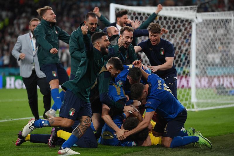 Italy players celebrate after beating England on penalties to win the Euro 2020 final atWembley Stadium in London, on Sunday, July 11.