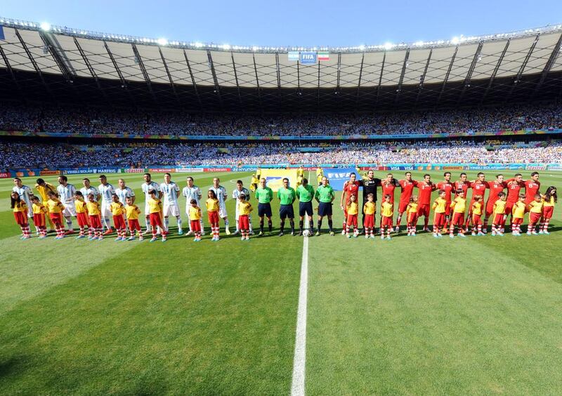 Teams pose prior the World Cup 2014 Group F match between Argentina, left, and Iran, right, at the Estadio Mineirao in Belo Horizonte, Brazil on Saturday. Peter Powell / EPA