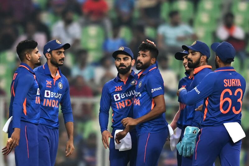 Mohammed Siraj (c) celebrates with teammates after taking the wicket of Sri Lanka's Kusal Mendis. AFP