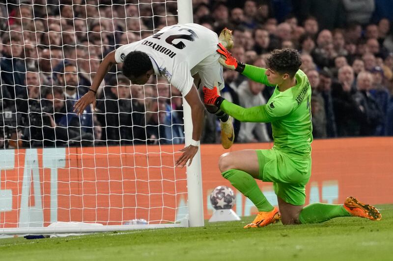 Real Madrid's Rodrygo is fouled by Chelsea's goalkeeper Kepa Arrizabalaga after scoring the second. AP 