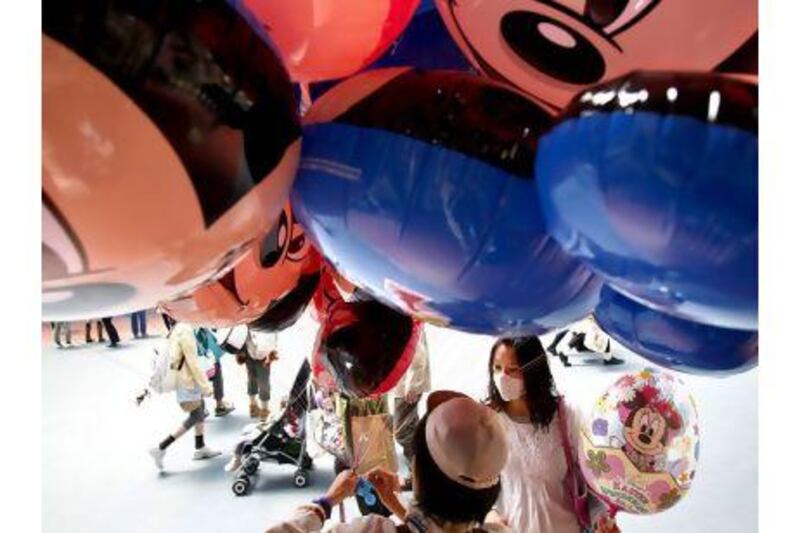 A worldwide shortage of helium has led Tokyo Disneyland to stop selling balloons filled with the gas. Kiyoshi Ota / Bloomberg News