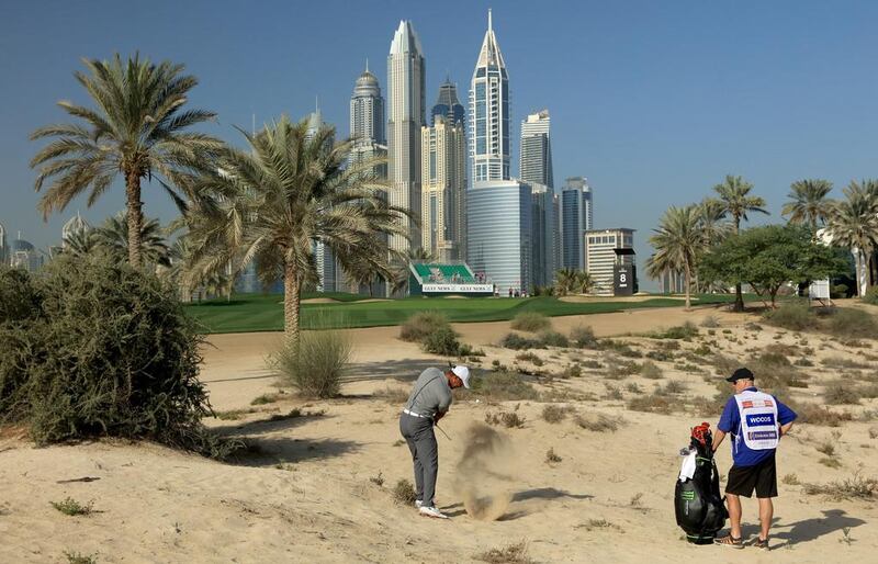 Tiger Woods plays his second shot on the eighth hole. David Cannon / Getty Images