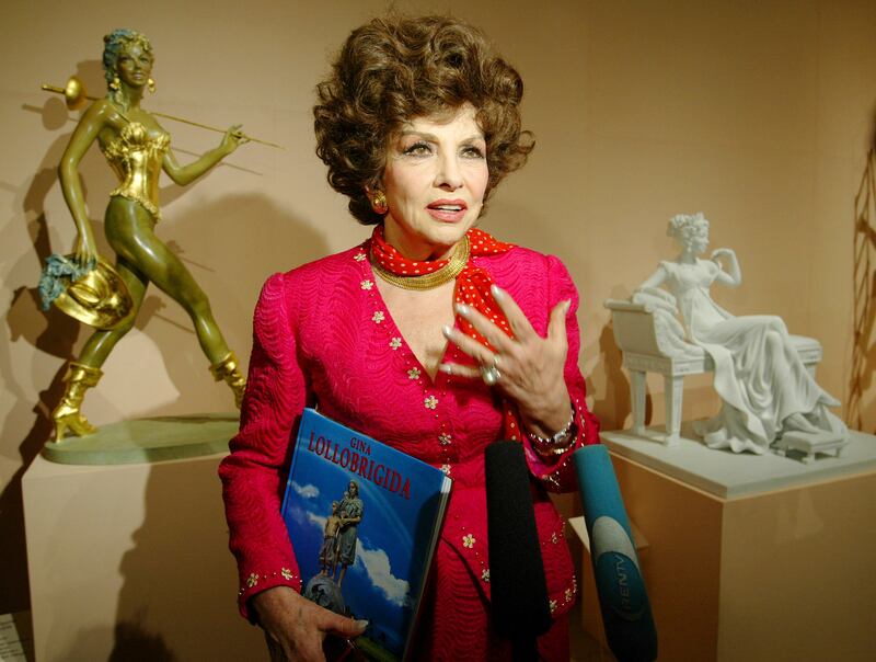 FILE - Italian actress Gina Lollobrigida speaks at the media viewing of the first exhibition of her sculptures at Moscow's Pushkin Museum of Fine Arts, on June 23, 2003.  Gina Lollobrigida, the Italian actress, photographer and sculptor who was dubbed "the most beautiful woman in the world" after the title of one her movies, has died in Rome.  (AP Photo /  Alexander Zemlianichenko, File)