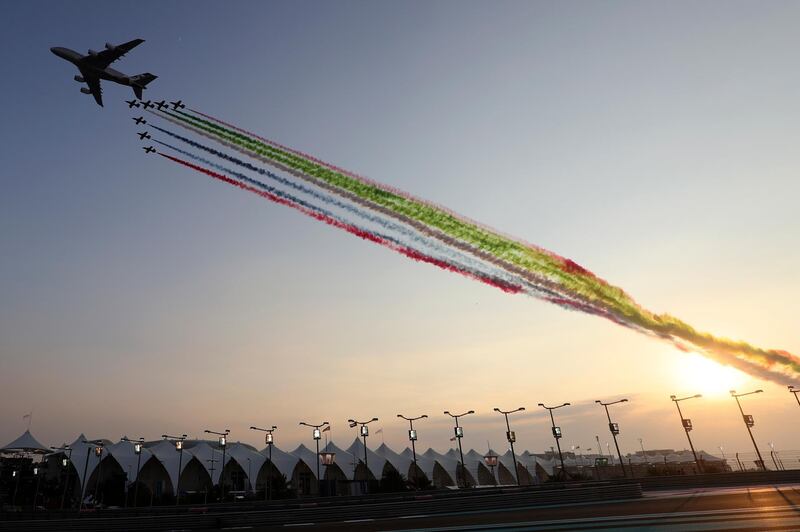 Planes spray the UAE flag colours over the track. AP Photo