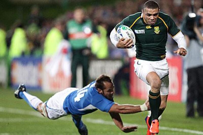 Brian Habana, right, skips past his opposite number, Namibia's Danie Dames, during South Africa's 87-0 thrashing of the minnows in Pool D.