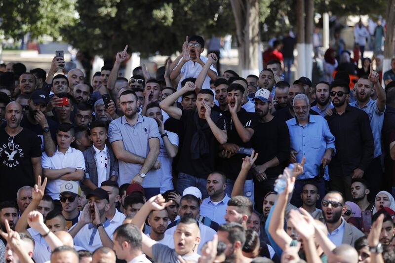 Palestinian Muslims shout anti-occupation slogans as Israeli security forces enter the Al Aqsa Mosque compound. AFP