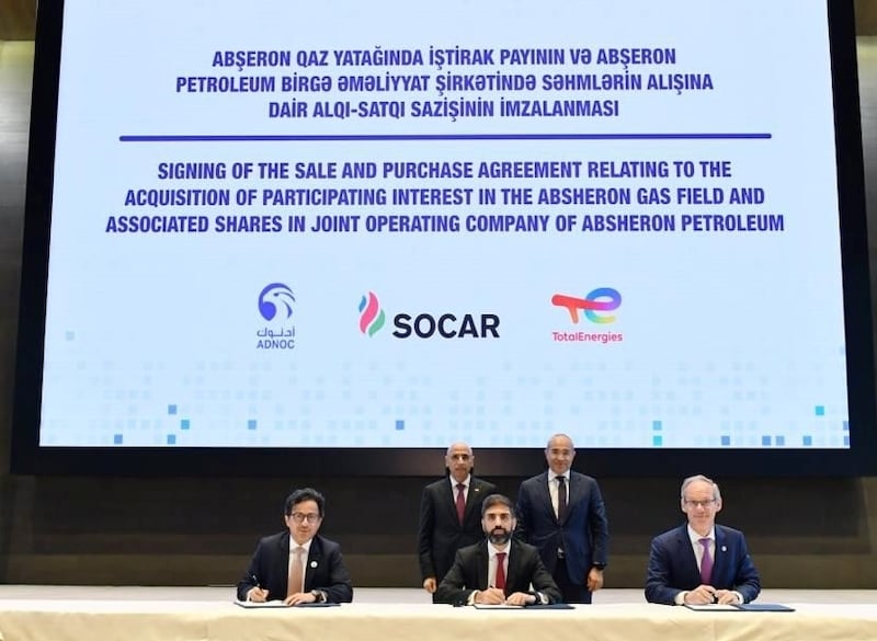 (From left to right) Musabbeh Al Kaabi, Adnoc's executive director of low carbon solutions and international growth; Rovshan Najaf, president of Socar; and Nicolas Terraz, president of exploration and production at TotalEnergies, sign an agreement for Adnoc to purchase a 30 per cent stake in the Absheron gas and condensate field in Azerbaijan. Photo: Adnoc