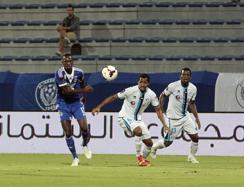 Mohammed Fawzi, centre, Abdul Almukhaini, right, and the rest of their Baniyas spent most of the night chasing Al Nasr's Ibrahima Toure. Jeffrey E Biteng / The National