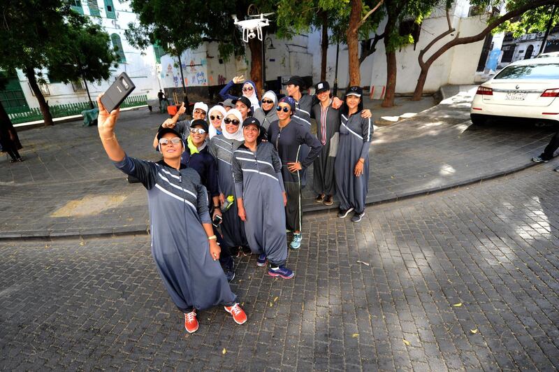 The joggers take a selfie. Amer Hilabi / AFP