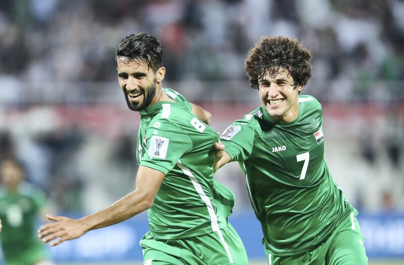 SHARJAH , UNITED ARAB EMIRATES , January 12 ��� 2019 :- Bashar Resan Bonyan ( no 13 in green Iraq left )  celebrating after scoring the 2nd goal during the AFC Asian Cup UAE 2019 football match between Yemen vs Iraq held at Sharjah Football Stadium in Sharjah. ( Pawan Singh / The National ) For News/Sports/Instagram