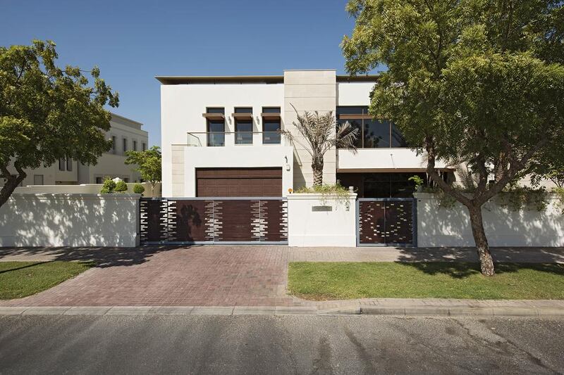 This Emirates Hills contemporary 15,000 sq ft property overlooks the 18-hole Montgomerie championship golf course, contains six bedrooms and 12 bathrooms and is on the market for Dh39.5m.  Courtesy Core Savills