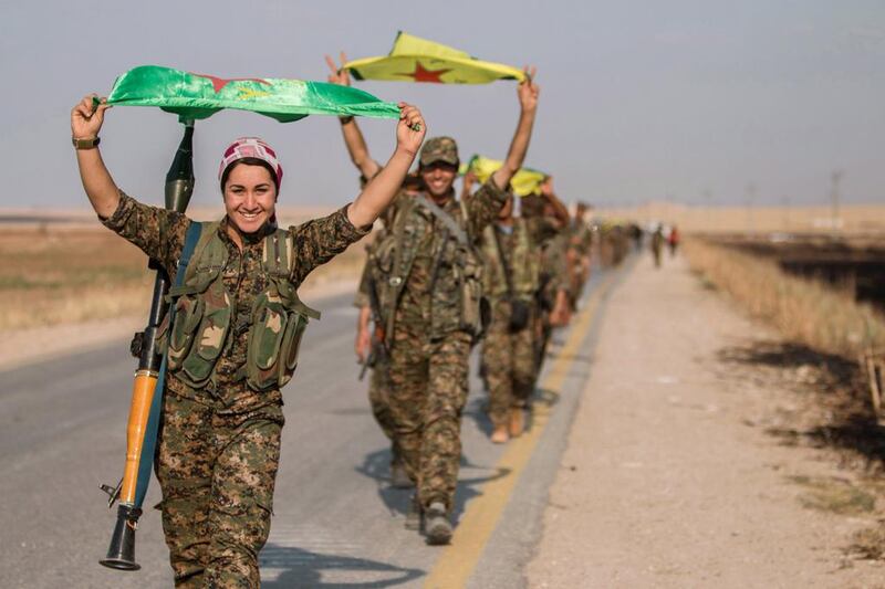 The Syrian Kurdish YPG militia said on Monday it had encircled the ISIL-controlled town of Tel Abyad, the nearest border town to the militant group’s de facto capital of Raqqa city. Rodi Said / Reuters