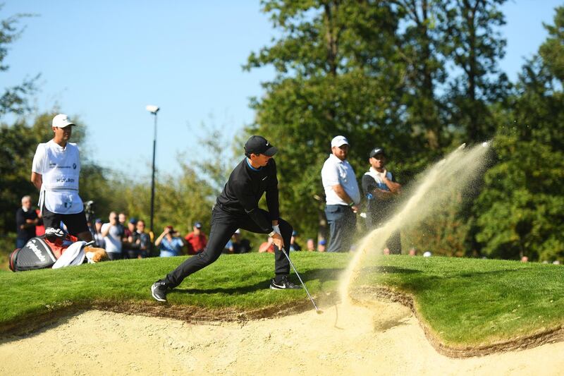 Rory McIlroy plays a shot out of a bunker on the 9th hole at the BMW PGA Championship at Wentworth Golf Club on Friday. The Northern Irishman finished the day 11 shots behind the leader after carding a 76. Getty