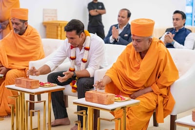 Indian actor Akshay Kumar takes part in a prayer ceremony as part of the construction of the Hindu temple in Abu Dhabi