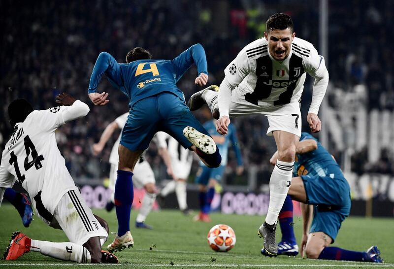 Juventus' Portuguese forward Cristiano Ronaldo, right, collides with Atletico Madrid's Colombian defender Santiago Arias. AFP