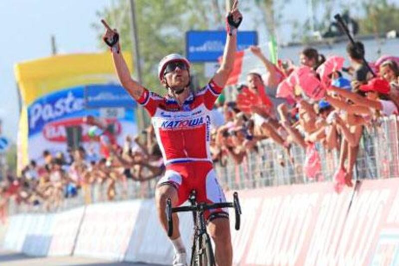Italian Luca Paolini crosses the finish line first to win the third stage of 96th Giro d'Italia going from Sorrento to Marina di Ascea