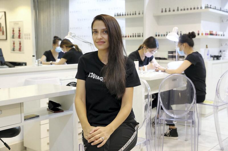 Nour Makarem, founder at the Lanour Beauty Lounge in Duja tower in Dubai on June 22,2021. Lanour Beauty Lounge in Dubai is offering microchip manicures, which paint a microchip which can double as a business card under the nail. The idea came about as a covid-friendly way of sharing business cards. Pawan Singh / The National. Story by Gill