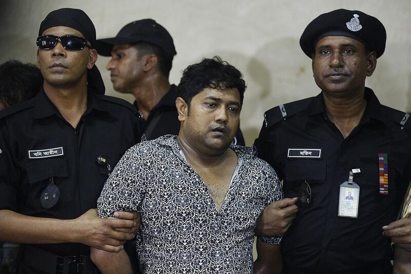Rana Plaza owner Sohel Rana (centre) has been jailed for three years for corruption. AFP