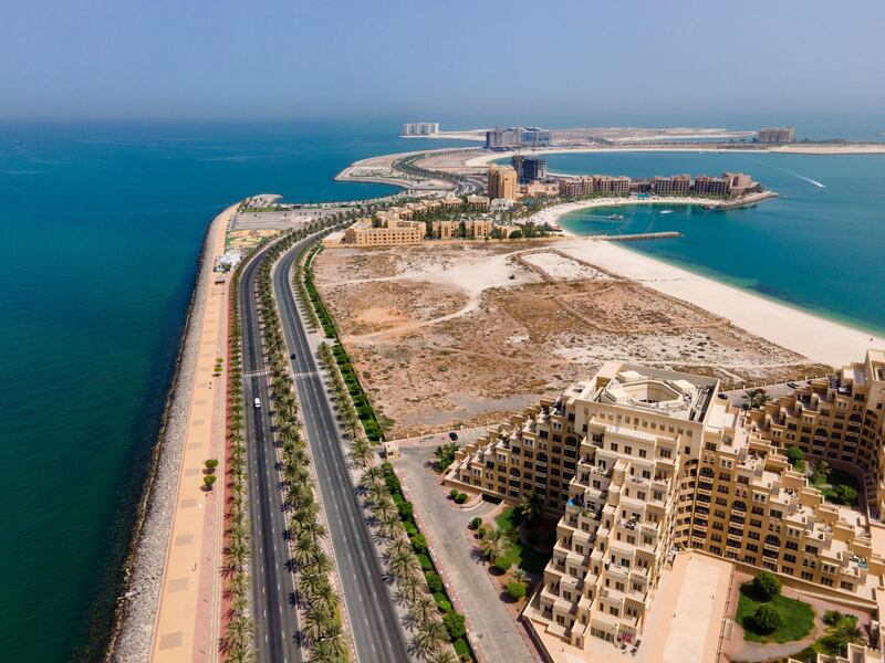 2C9WP45 Man made Marjan Island in emirate of Ras al Khaimah in the United Arab Emirates aerial view at sunrise of the characteristic architecture and waterfront. Alamy