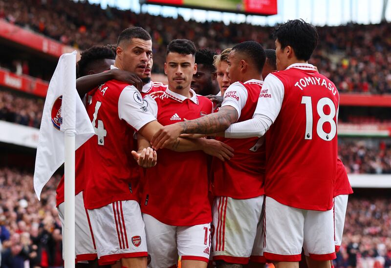 Gabriel Martinelli celebrates scoring their first goal with teammates. Reuters