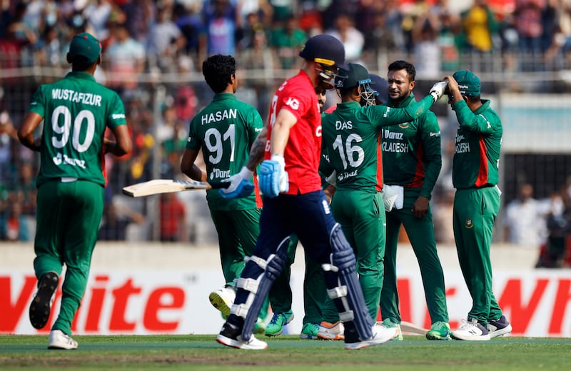 Bangladesh captain Shakib Al Hasan celebrates with teammates after taking the wicket of England opener Phil Salt for 25. Reuters