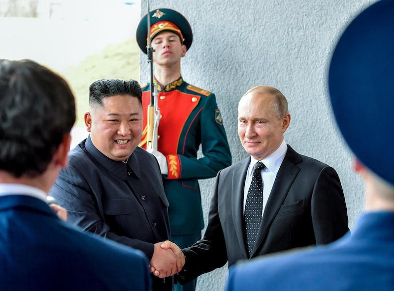 Russian President Vladimir Putin and North Korea's leader Kim Jong-un shake hands during their meeting in Vladivostok. Yuri Kadobnov / Pool Photo via AP