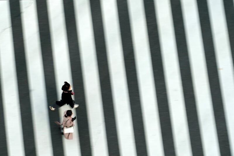 People on a pedestrian crossing in Tokyo, Japan. AP Photo